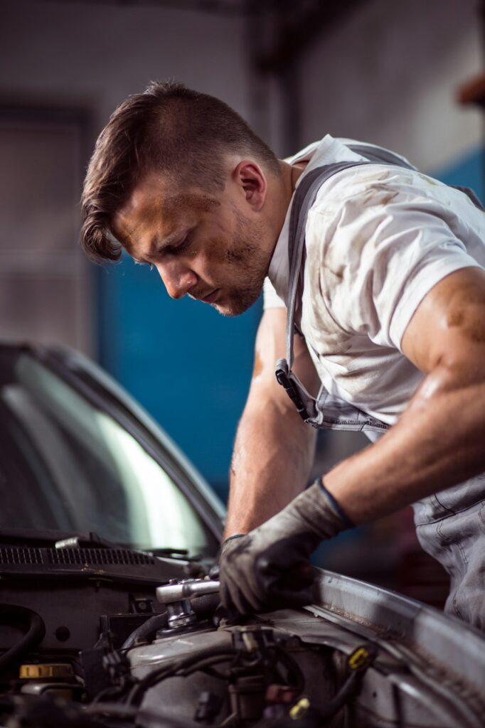 Handsome mechanic working