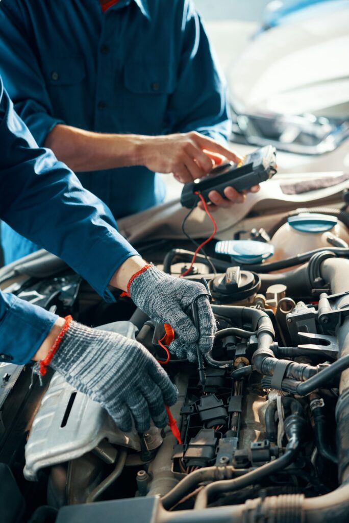 Mechanics testing car motor